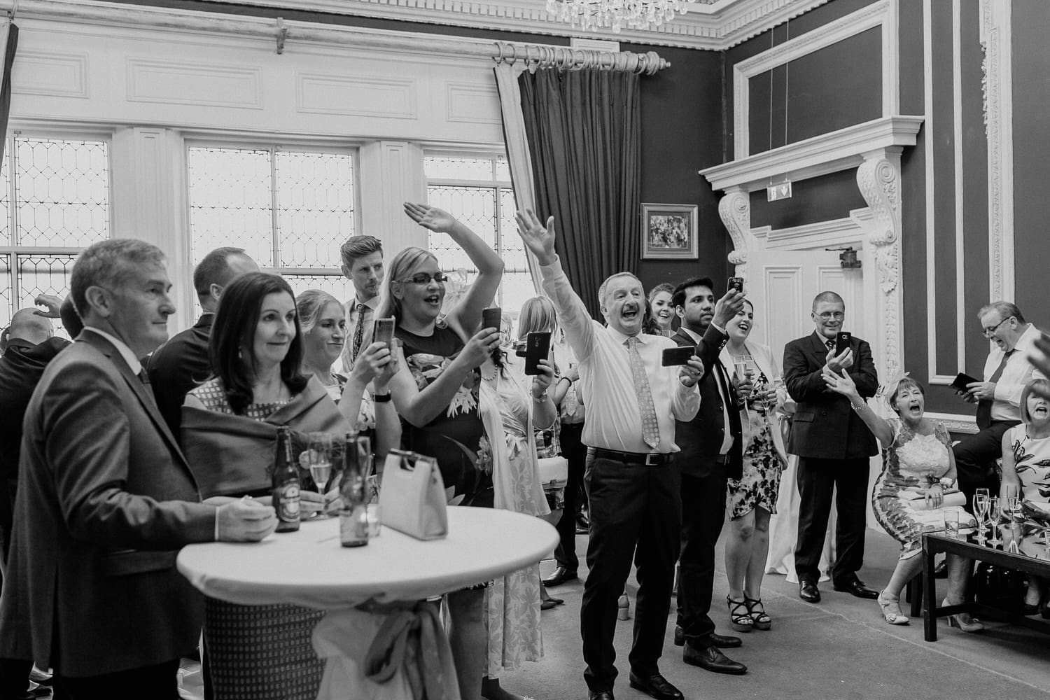 Happy wedding guests enjoying a drinks reception at Stephen's Green Club in Dublin. 