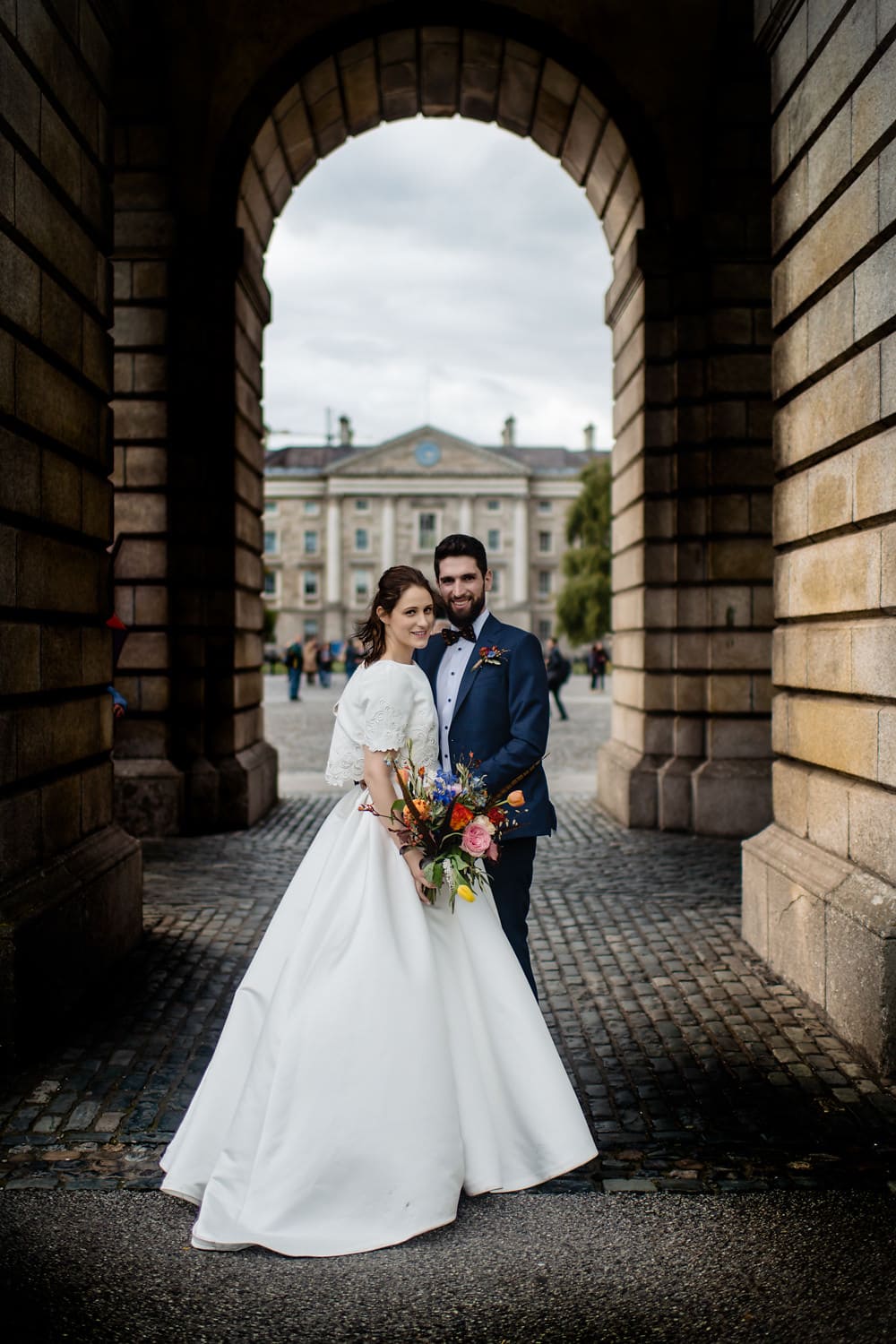 Wedding Couple posing at Trinity College, Dublin