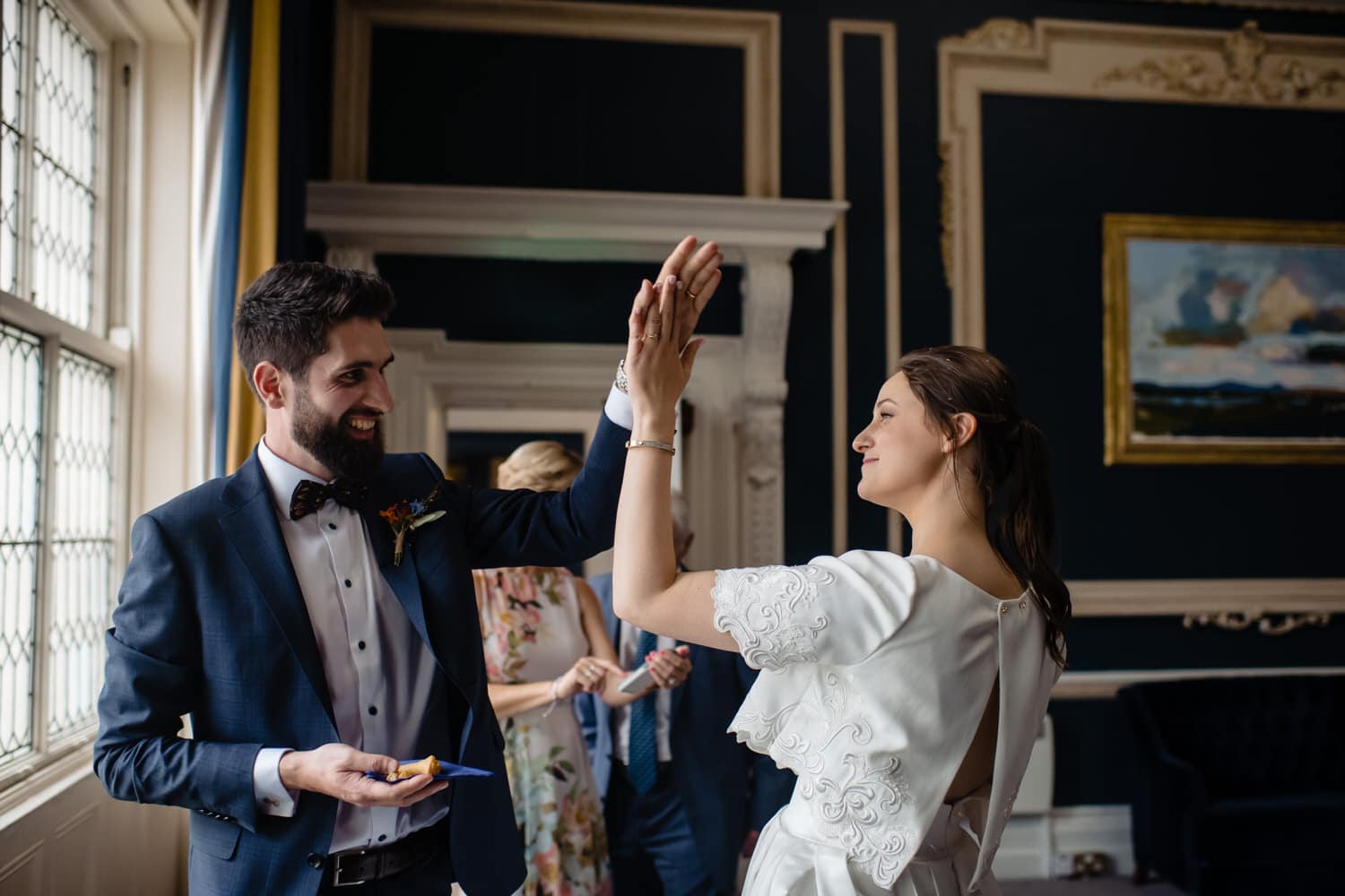 Wedding Couple high fiving after getting married at Stephen's Green Club in Dublin