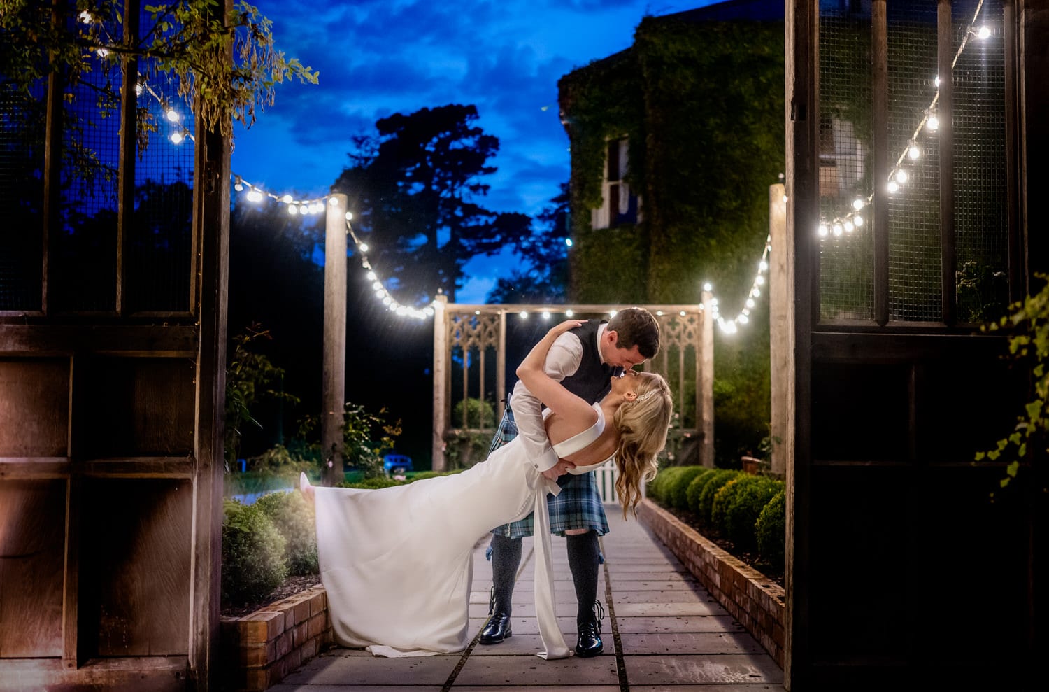 Couple dancing under twinling lights at dusk at Tinakilly Country House